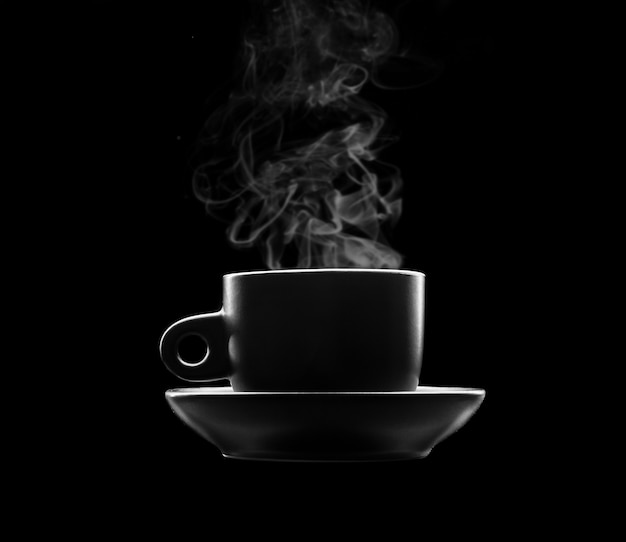 Cup of hot beverage on black