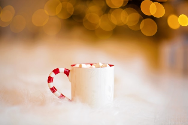 Cup of hot cocoa in christmas atmosphere