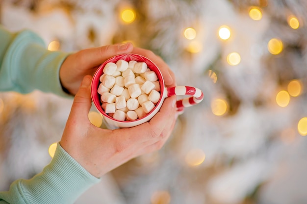 Cup of hot cocoa in christmas atmosphere