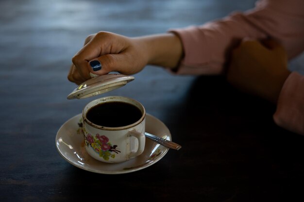 Photo a cup of hot coffee is on the table