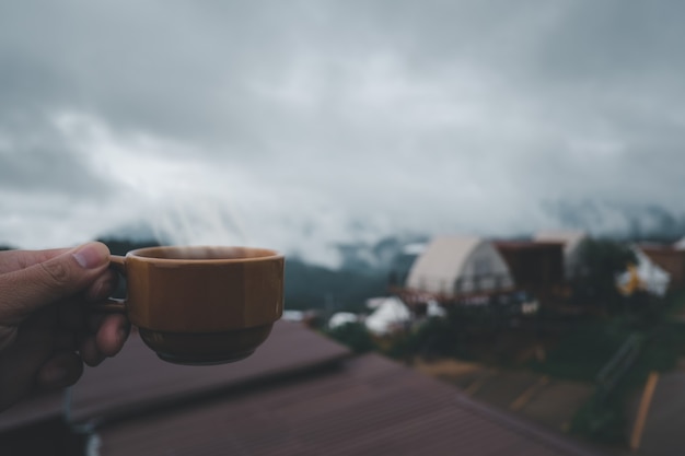 Cup of hot coffee in the nature