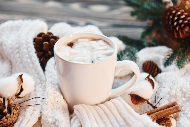 Cup of hot drink Christmas background with holiday decoration