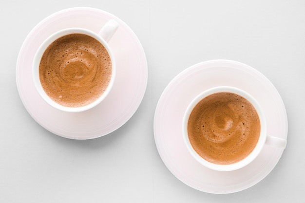 Cup of hot french coffee as breakfast drink flatlay cups on white background