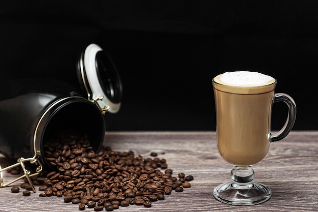 A Cup of hot latte or cappuccino on a wooden table