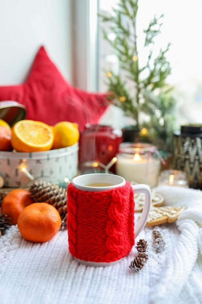 A cup of hot steaming tea in a New Year's atmosphere aesthetic photo