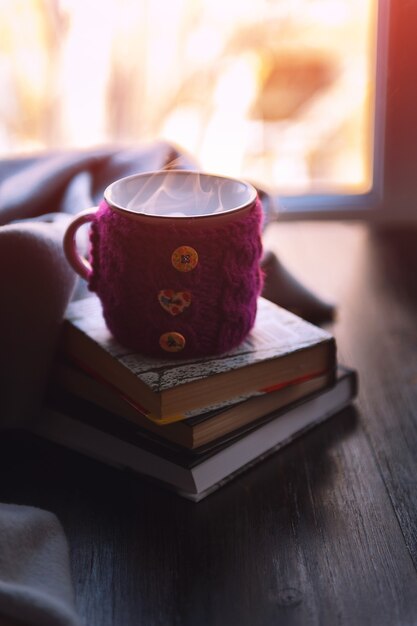 cup of hot tea and books