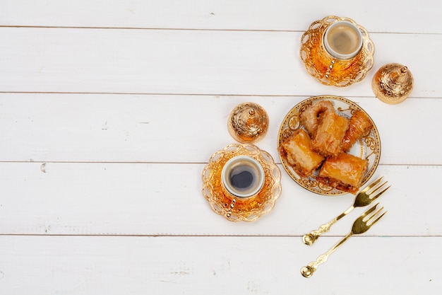 Cup of hot tea and a plate of turkish desserts