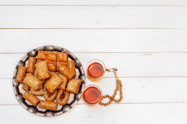 Cup of hot tea and a plate of turkish desserts