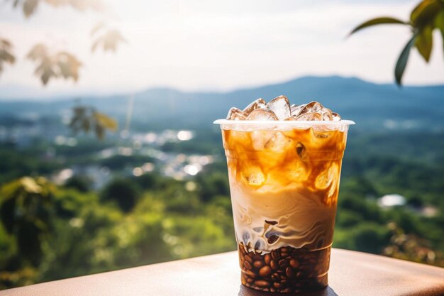 a cup of iced coffee sitting on top of a table