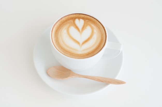 A cup of latte art on white background