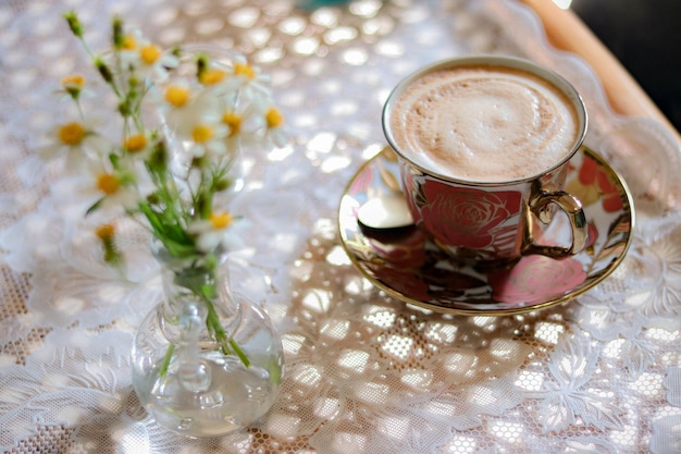 a cup of latte coffee on table