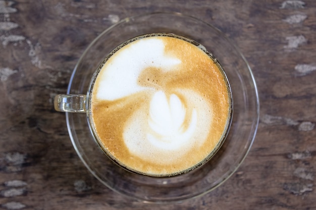 cup of latte coffee on wood table