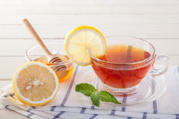 Cup of lemon tea and lemon slice