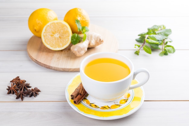 Cup of lemon tea with ginger