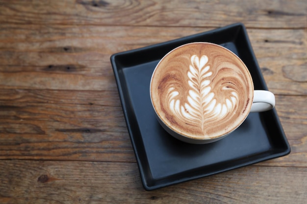 Cup of mocha coffee on wooden table