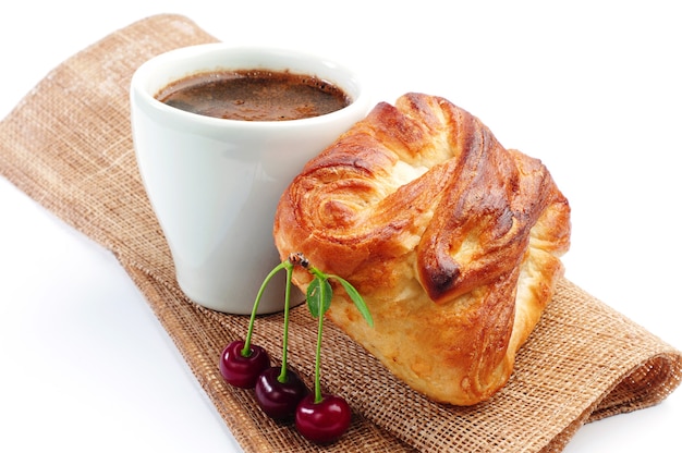 https://img.freepik.com/premium-photo/cup-of-hot-coffee-with-bun-and-cherry-on-white_288431-1865.jpg