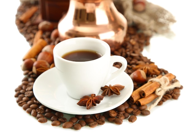 Cup and pot of coffee and coffee beans isolated on white