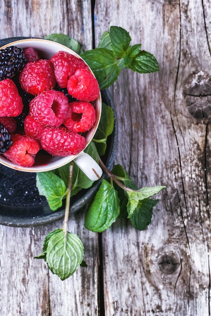 Cup of raspberries and blackberries