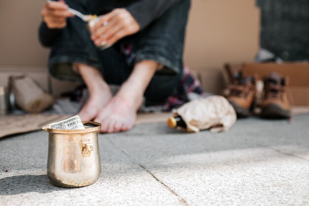 cup standing on concrete ground.