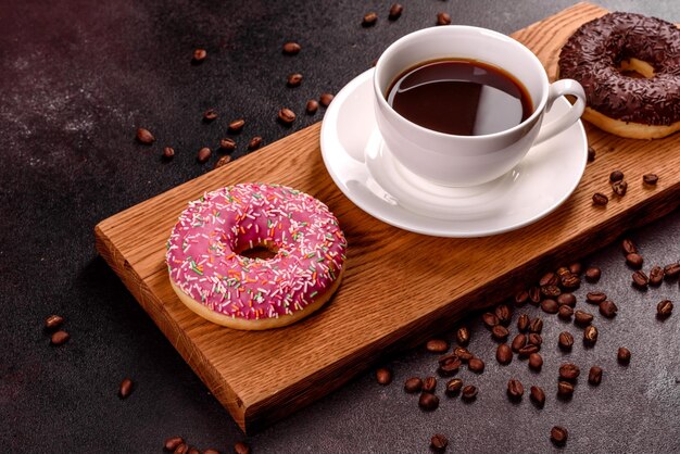 Photo a cup of strong coffee on the christmas table with spruce twigs and toys