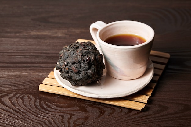 Cup of Tamarind tea (or Date Tea) on wooden table