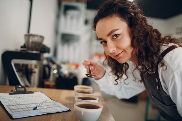 Cup Taster Girl Tasting Degustation Coffee Quality Test. Coffee Cupping