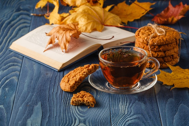 Cup of tea and book on table