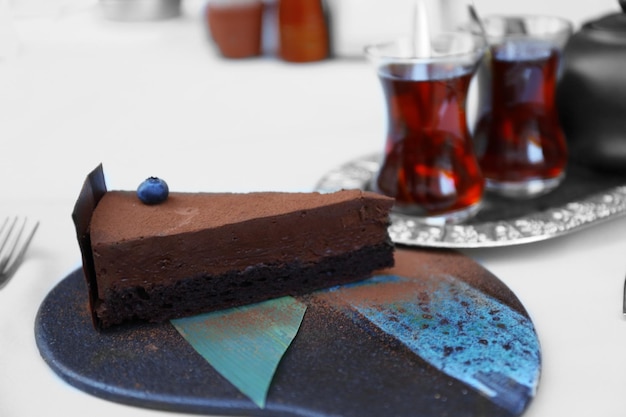 Cup of tea and cake on a table in cafe