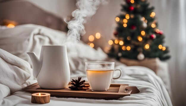 Photo a cup of tea and a cup of tea are on a tray with a christmas tree in the background