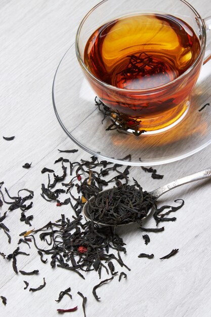 Photo cup of tea on a light wooden background