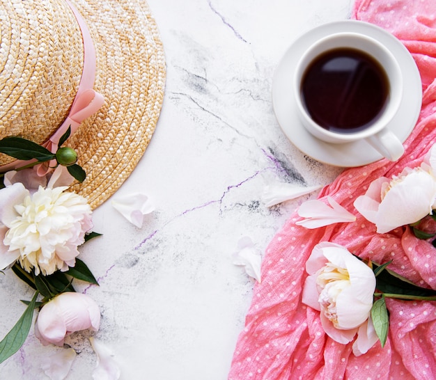 Cup of tea and peonies