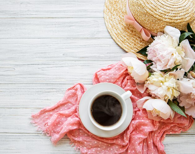 Cup of tea and peonies