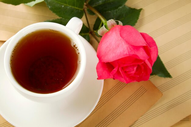 A cup of tea and rose