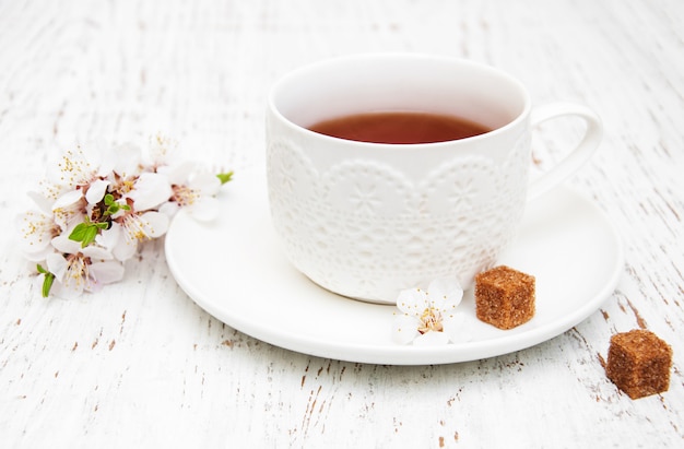 Cup of tea and spring blossom