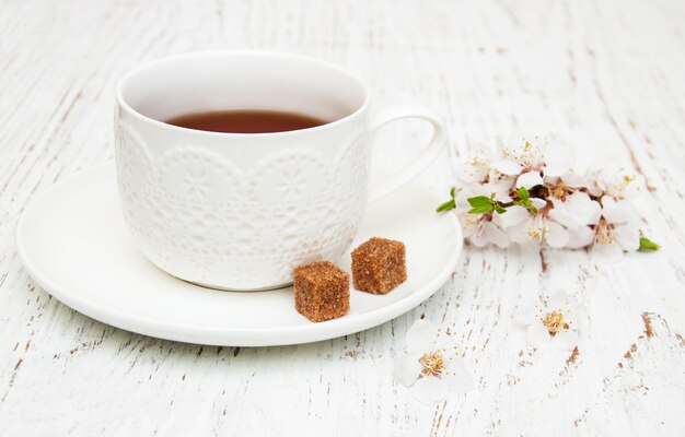 Cup of tea and spring blossom