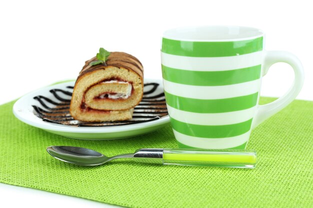 Cup of tea and sweets isolated on white