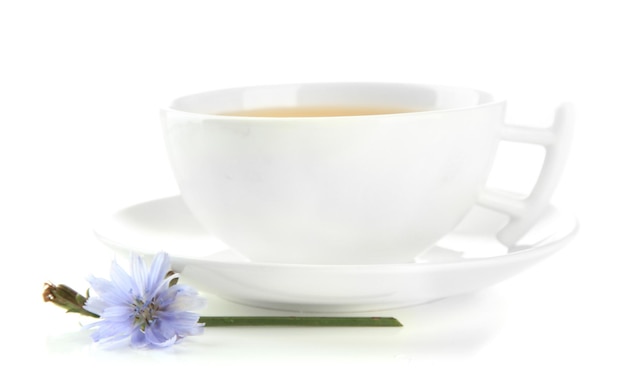 Cup of tea with chicory isolated on white