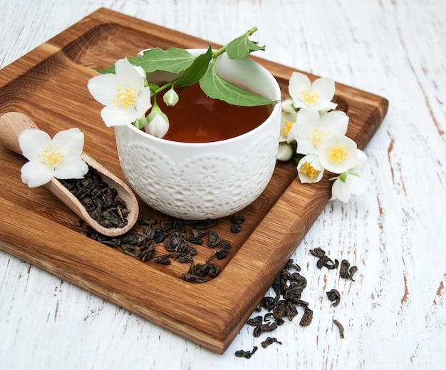 Cup of tea with jasmine flowers