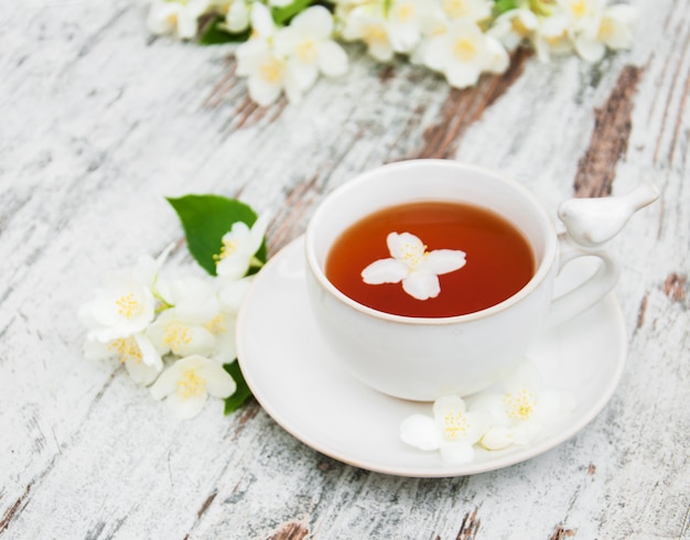 Cup of tea with jasmine flowers