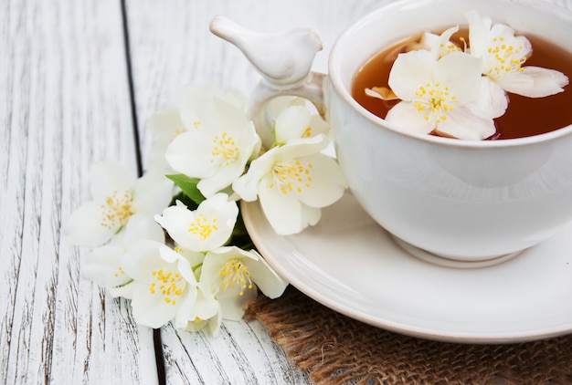 Cup of tea with jasmine flowers