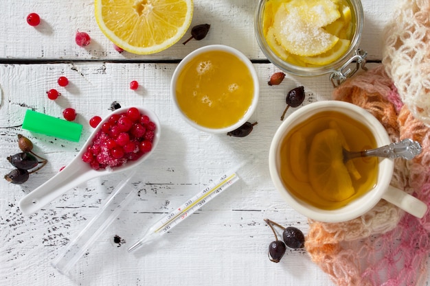 Cup of tea with lemon and berries