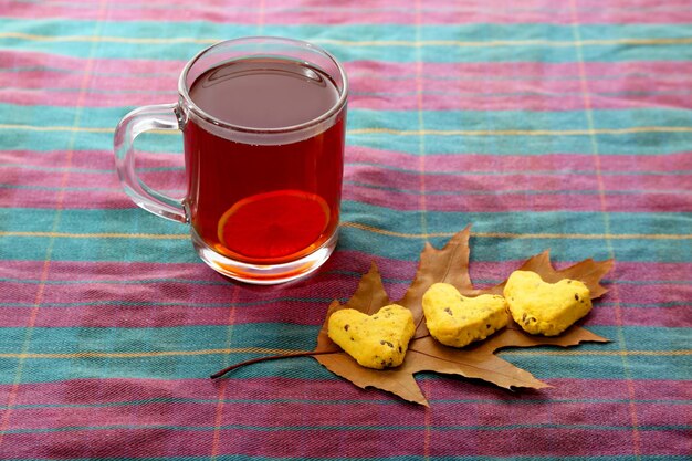 Cup of tea with lemon and biscuits