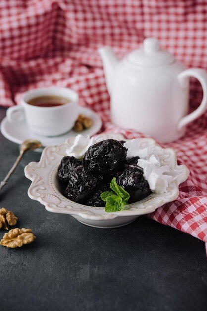 Cup of tea with prunes top view