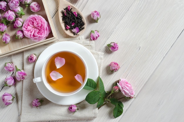 Cup of tea with rose petals