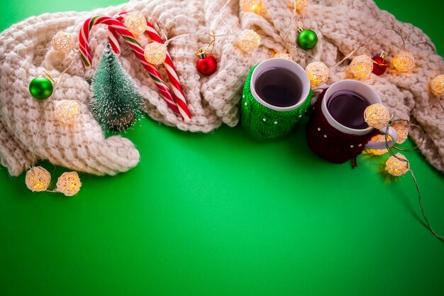 Cup of tea with a scarf Christmas background