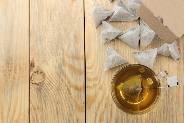 Cup of tea with tea bags on the table