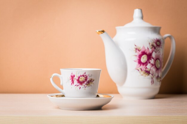 Cup of tea with teapot in vintage style