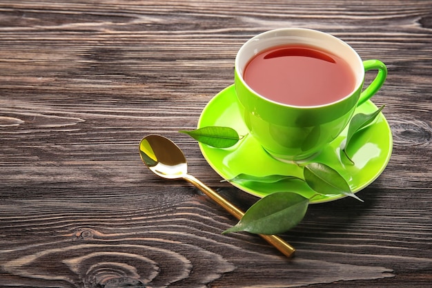 Photo cup of tea on wooden table weight loss concept