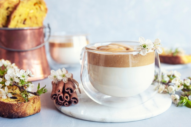 Cup of Trendy whipped cream cold dalgona coffee and Italian biscotti