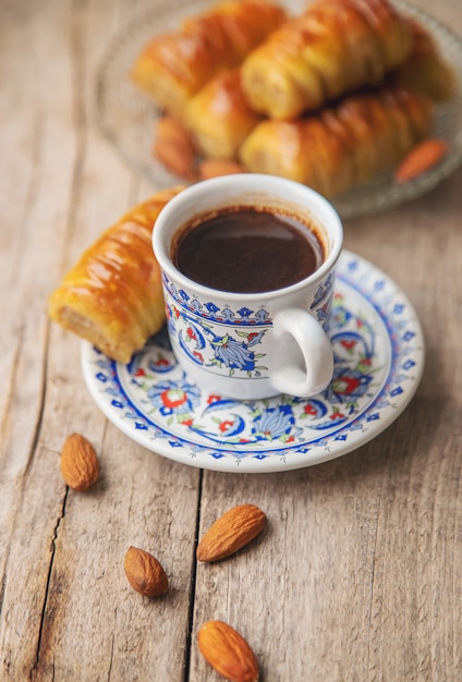 A cup of Turkish coffee and baklava. 